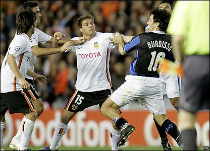 Inter's Nicolas Burdisso under attack from Valencia's Sanchez