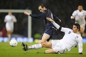 Andrea Barzagli stops James McFadden with a sliding tackle; the Palermo defender was one of the best players of the game Saturday