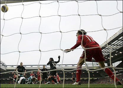 Carlitos Tevez turns in Wayne Rooney's shot just before half time.