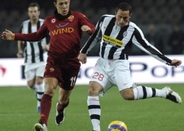 Cristian Molinaro (left) challenged by Rodrigo Taddei