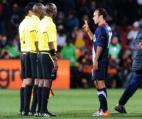  Landon Donovan with the match officials after the game at Ellis Park