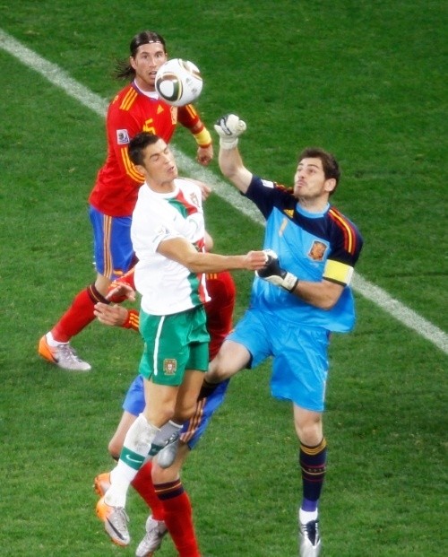 Cristiano Ronaldo challenging for a ball against his Real Madrid teammate, Iker Casillas