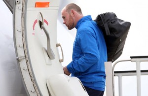 9414067 Rooney boards the plane for Switzerland