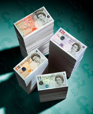 Piles of British Pounds
