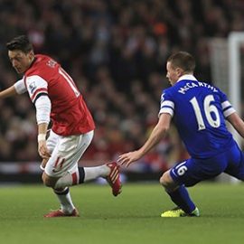 Arsenal's Mesut Ozil and Everton's James McCarthy