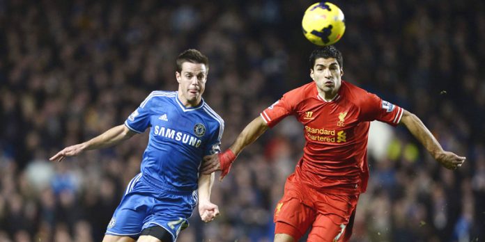 Chelsea's Azpilicueta challenges Liverpool's Suarez during their English Premier League soccer match at Stamford Bridge in London