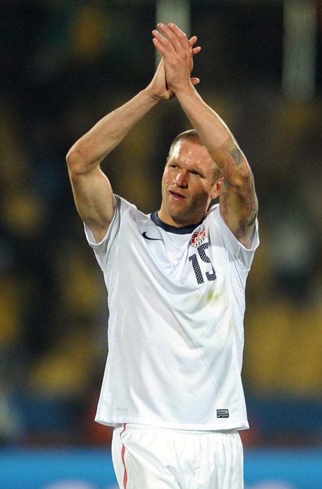 A dejected Jay DeMerit of USA applauds the supporters at full-time