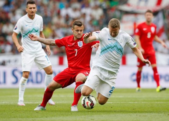 Jack Wilshere in action with Ales Mertelj