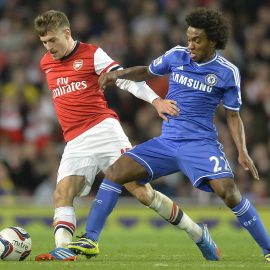 Arsenal's Ramsey challenges Chelsea's Willian during their English League Cup fourth round soccer match at Emirates Stadium in London