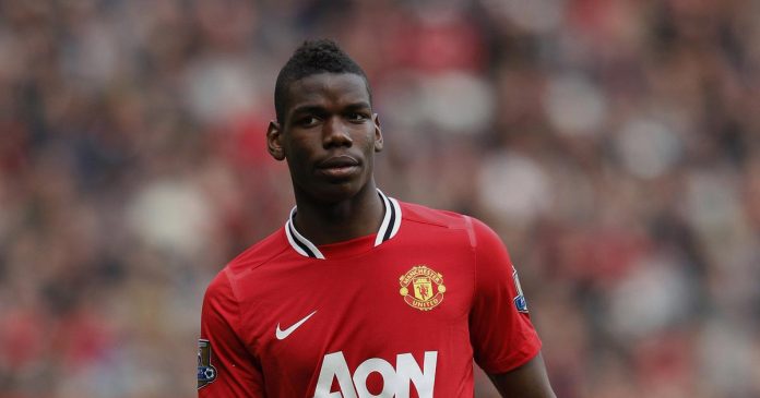 Manchester United's Pogba walks across the pitch during their English Premier League soccer match against West Bromwich Albion in Manchester