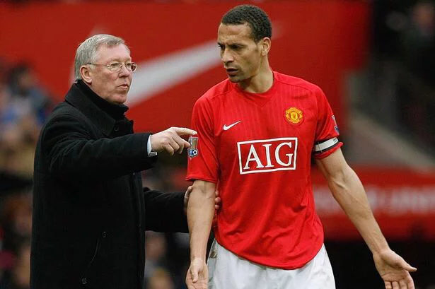 Sir Alex Ferguson talking tactics with Rio Ferdinand.
