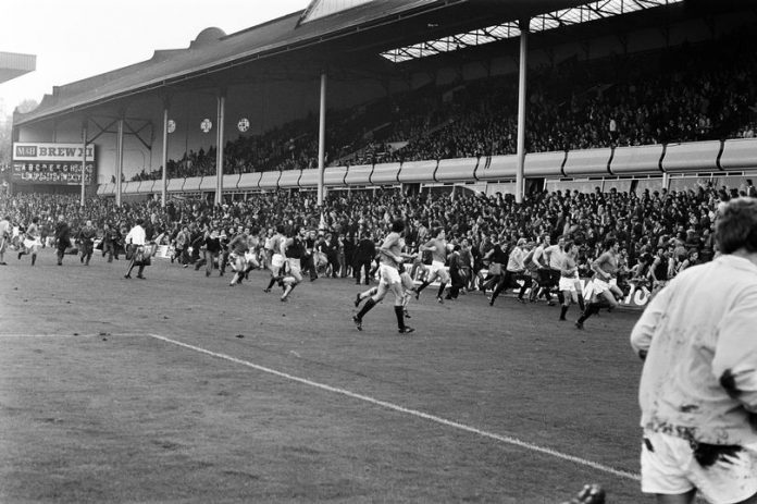 Players-sprint-from-the-Villa-Park-pitch-to-escape-the-crowd-trouble-during-Aston-Villas-abandoned-match-against-Rangers