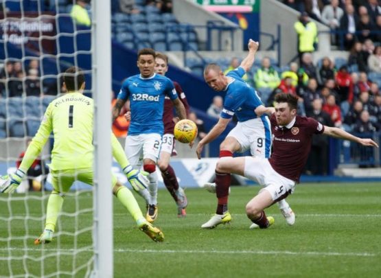 Kenny Miller scores for Rangers against Hearts in a 3-1 win.