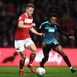 adam-webster-of-bristol-city-battles-for-possession-with-kyle-edwards-picture-id1141524411
