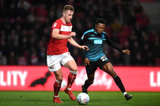 adam-webster-of-bristol-city-battles-for-possession-with-kyle-edwards-picture-id1141524411