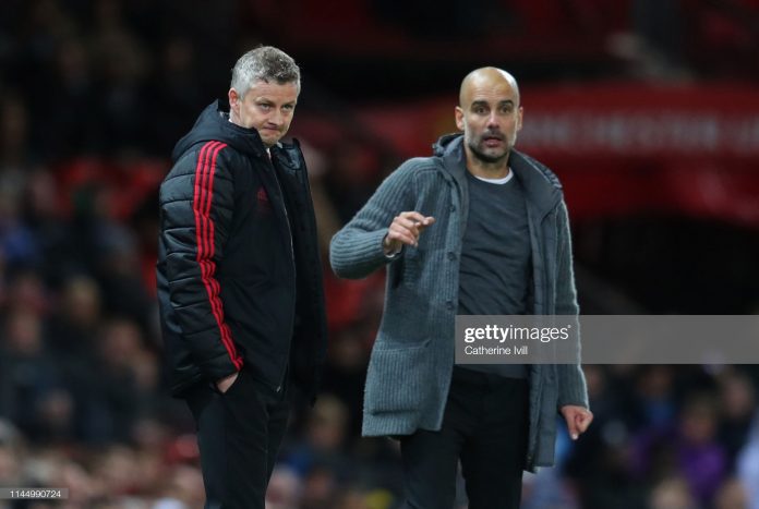 ole-gunnar-solskjaer-manager-of-manchester-united-and-pep-guardiola-picture-id1144990724