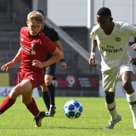 paul-glatzel-of-liverpool-and-raphael-nya-of-paris-saintgermain-in-picture-id1035656366