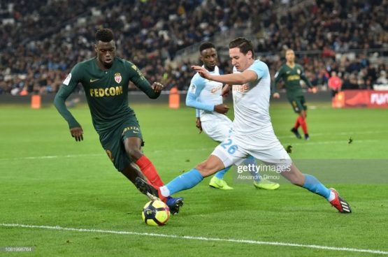 benoit-badiashile-of-monaco-and-florian-thauvin-of-marseille-during-picture-id1081998764