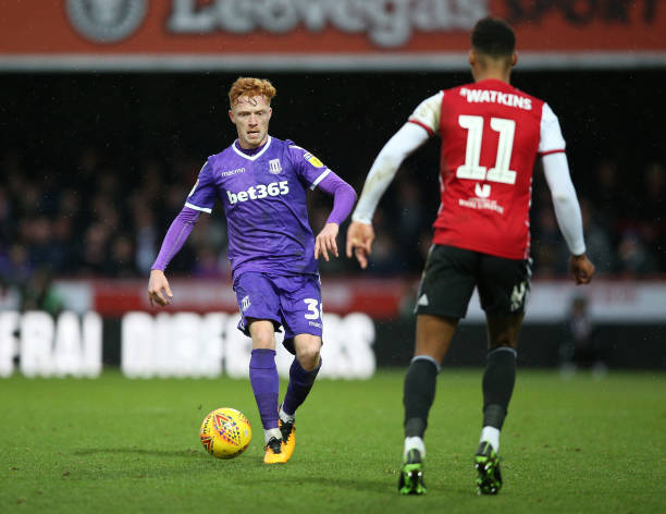 brentfords-ollie-watkins-and-stoke-citys-ryan-woods-battle-for-the-picture-id1081311202